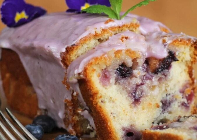 a lemon blueberry drizzle cake perfect for a list of vegan cakes to make this weekend