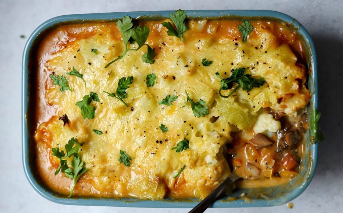 meat-free cottage pie with leek and cauliflower topping plus mushrooms, vegan grated cheese, and herbs for vegan family dinner ideas