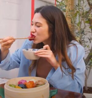 Shizuka Anderson, the host of Japan by Food YouTube channel, trying out vegan gyozas in a vegan guide to Japan video