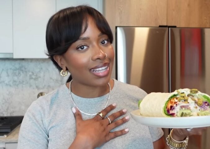 Shakayla Felice showing three high-protein vegan lunch wraps to eat