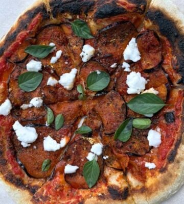 A vegan aubergine and harissa pizza with dairy-free feta cheese