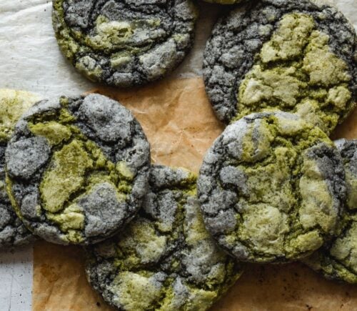 black sesame seed and matcha cookies laid out on a table