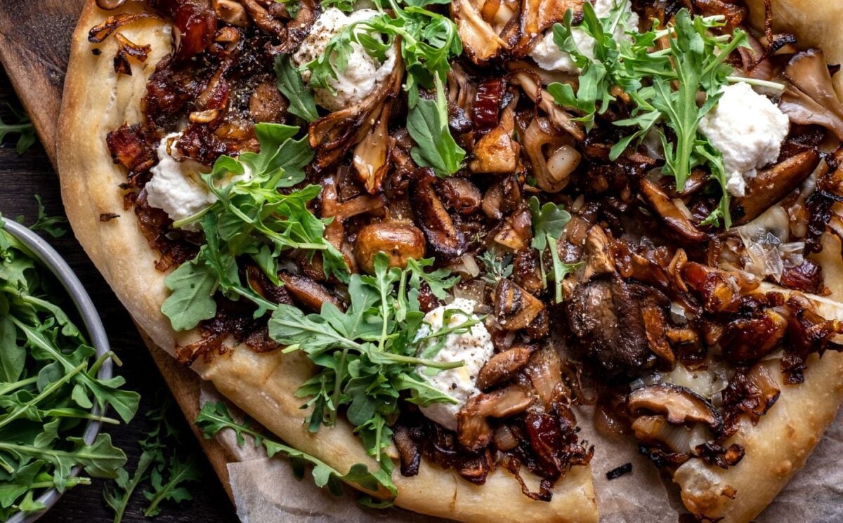 a caramelized shallot and wild mushroom pizza with dates and arugula