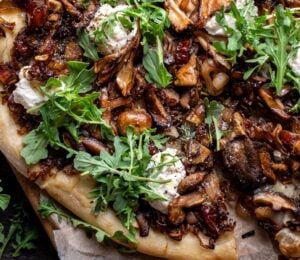 a caramelized shallot and wild mushroom pizza with dates and arugula