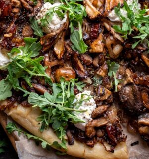 a caramelized shallot and wild mushroom pizza with dates and arugula
