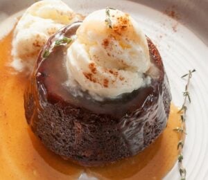 carrot cake sticky toffee pudding with vegan ice cream on top