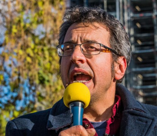 Photo shows journalist and activist George Monbiot speaking at a demonstration