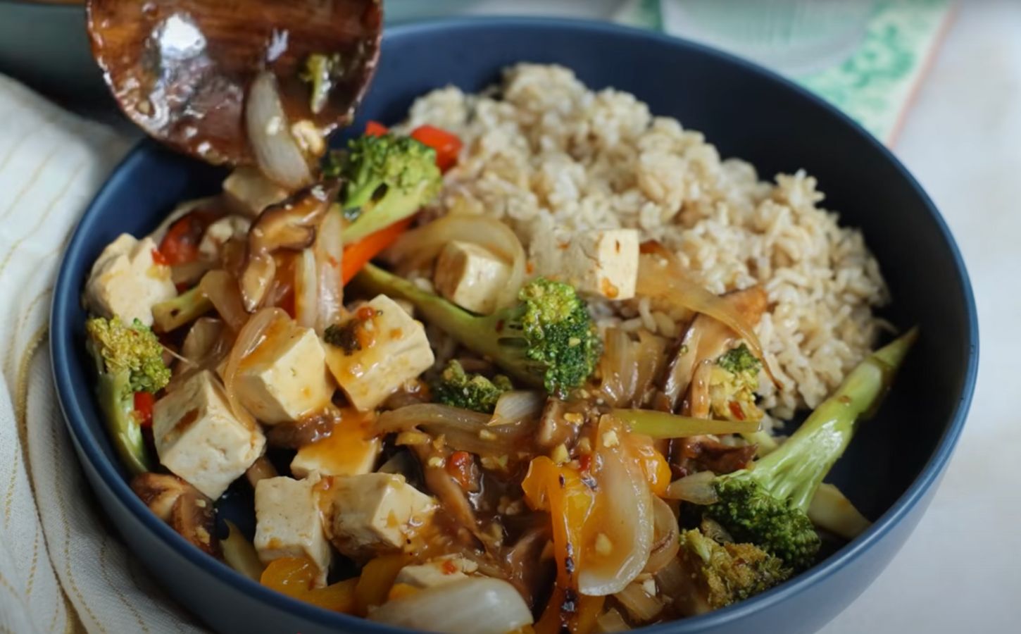 A tofu stir fry with vegetables and brown rice, a high fiber recipe