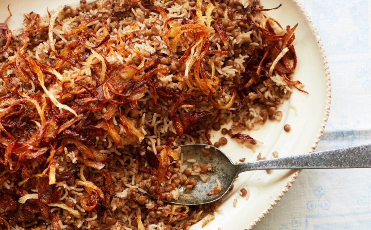 a bowl of lentils and rice with caramelized onions to share