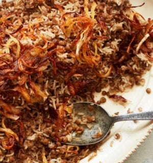 a bowl of lentils and rice with caramelized onions to share