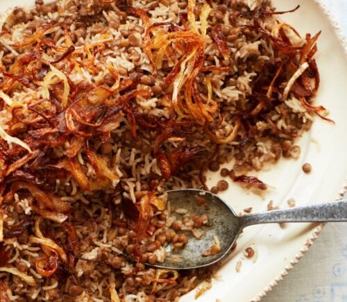 a bowl of lentils and rice with caramelized onions to share