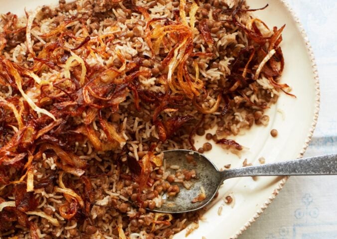 a bowl of lentils and rice with caramelized onions to share