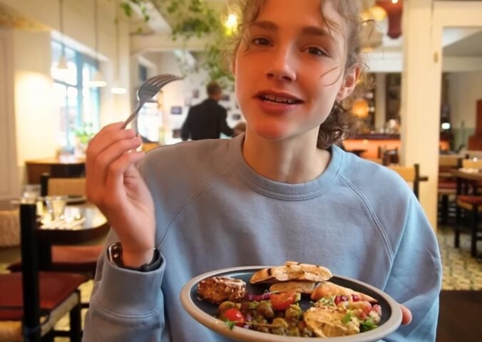 Maya Leinenbach eating vegan Syrian food on her London vegan food guide