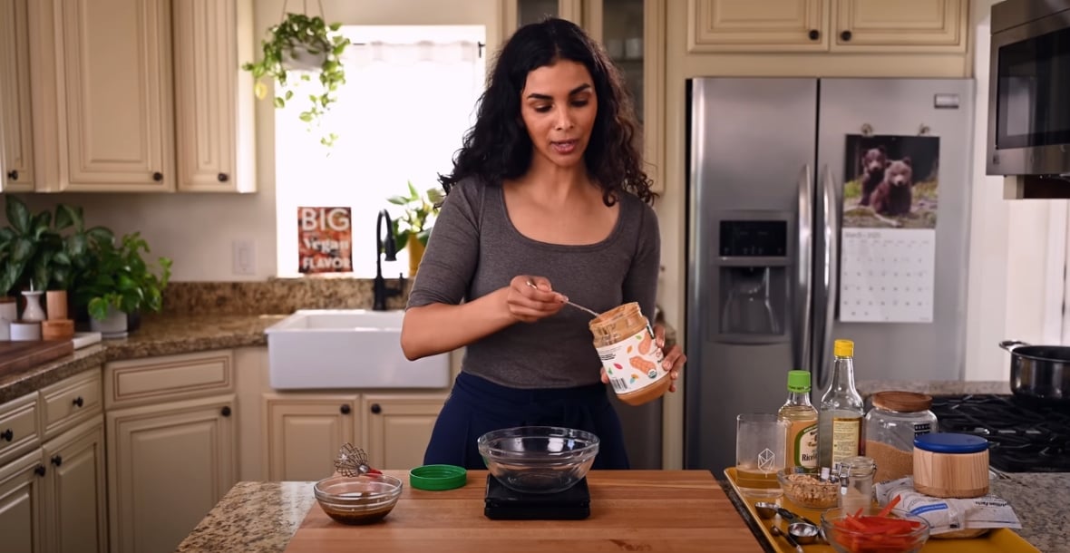 Nisha Vora preparing a peanut sauce for peanut butter noodles