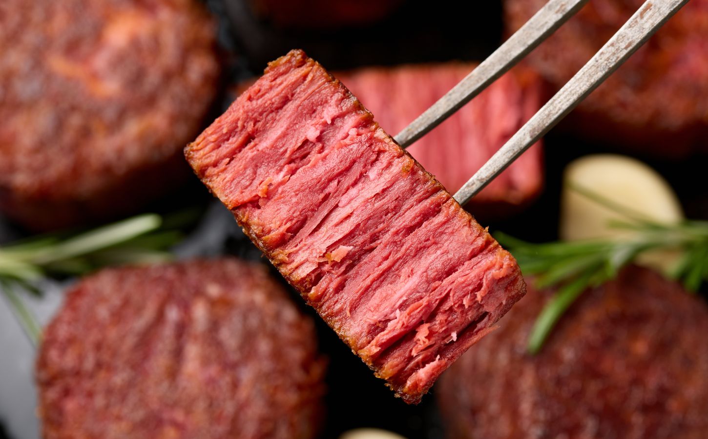 Photo shows a piece of plant-based meat on a fork