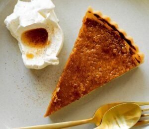 pumpkin and bourbon brulee tart with a maple syrup and bourbon sauce