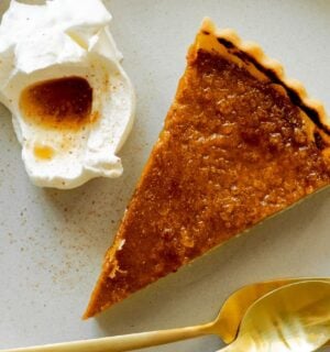pumpkin and bourbon brulee tart with a maple syrup and bourbon sauce