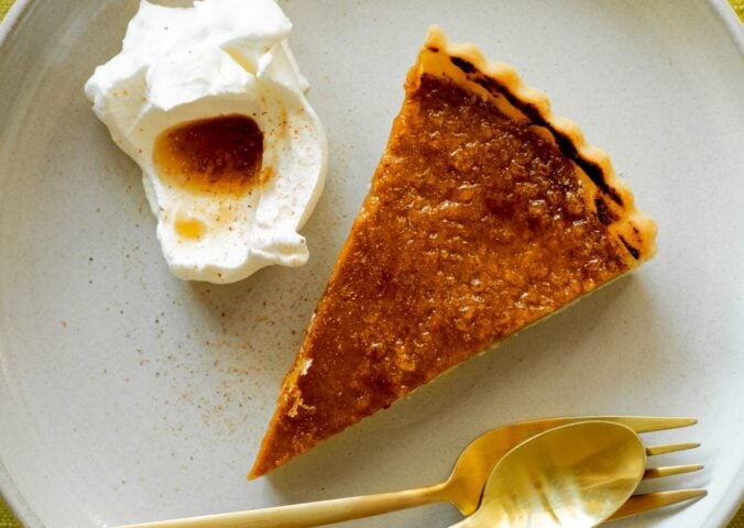 pumpkin and bourbon brulee tart with a maple syrup and bourbon sauce