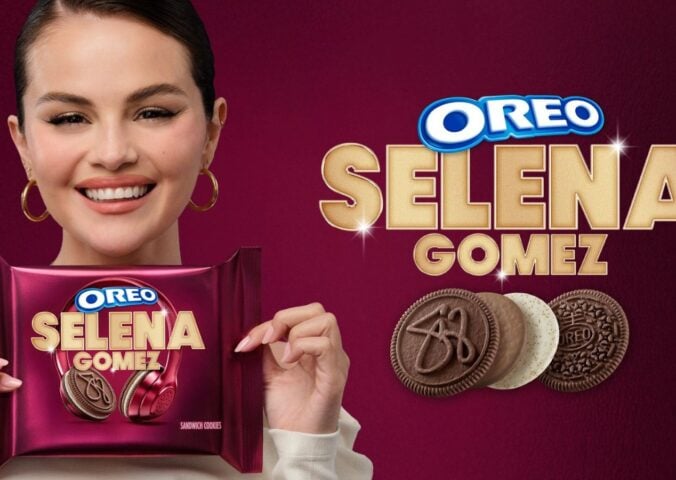 Photo shows Selena Gomez on a purple background holding up the new Oreo cookies she helped to design