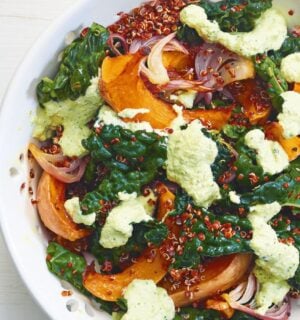 A squash and raw kale quinoa salad with cashew dressing