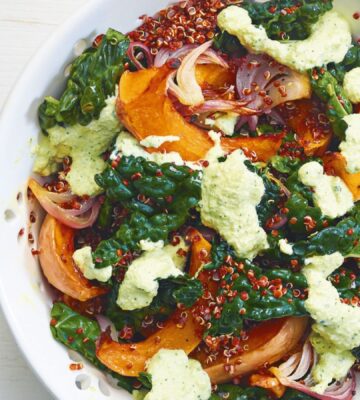 A squash and raw kale quinoa salad with cashew dressing