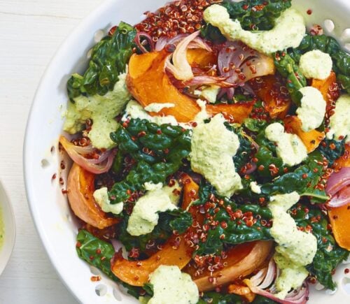 A squash and raw kale quinoa salad with cashew dressing