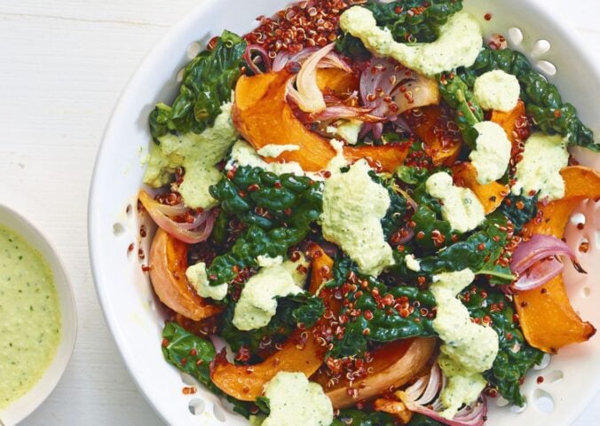 A squash and raw kale quinoa salad with cashew dressing