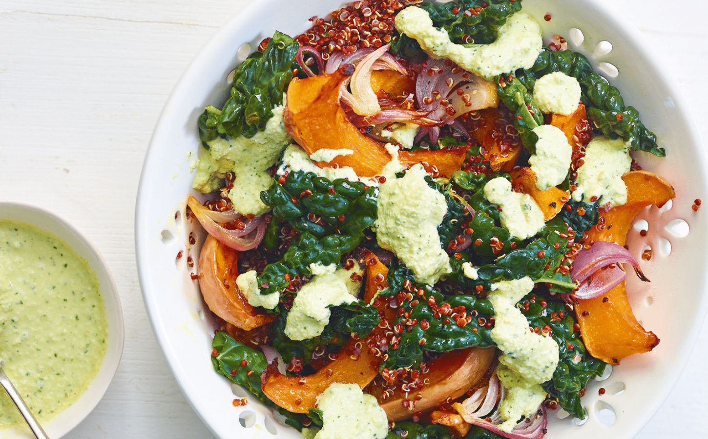 A squash and raw kale quinoa salad with cashew dressing