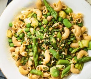 a summer veg and white bean pasta with edamame and asparagus