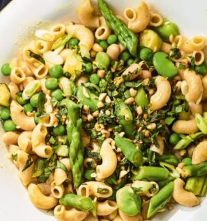 a summer veg and white bean pasta with edamame and asparagus