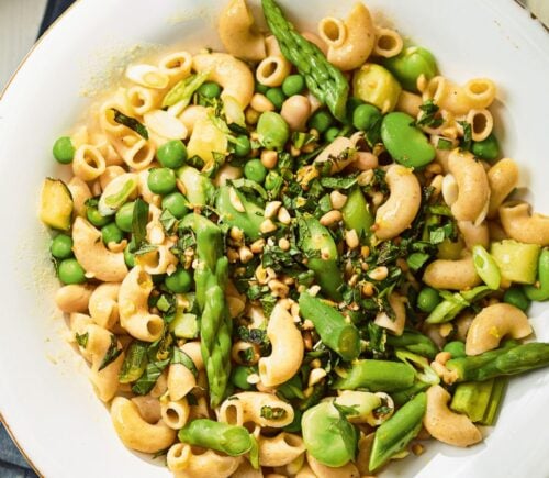 a summer veg and white bean pasta with edamame and asparagus