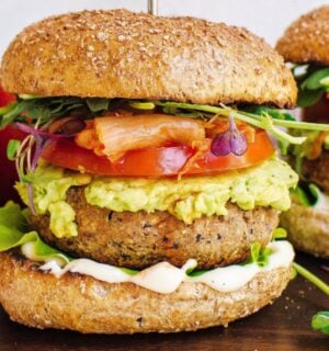 Two tempeh and apple burgers with tomato and avocado
