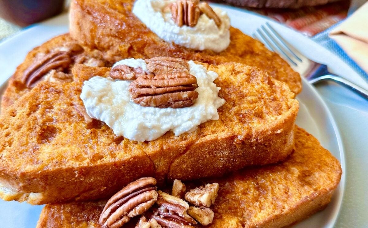 oven-baked French toast with pumpkin batter, coconut whipped cream, cinnamon and pecans for vegan brunch recipes