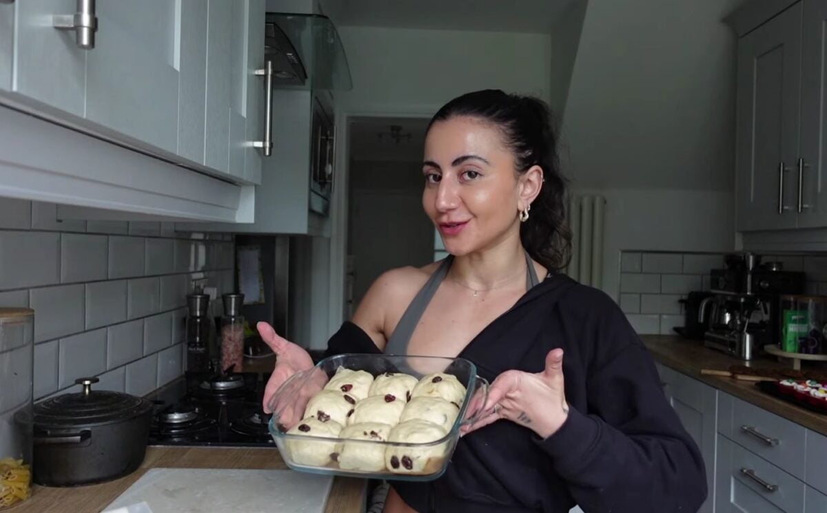 a picture of Leila Hannoun holding hot cross buns for her vegan café
