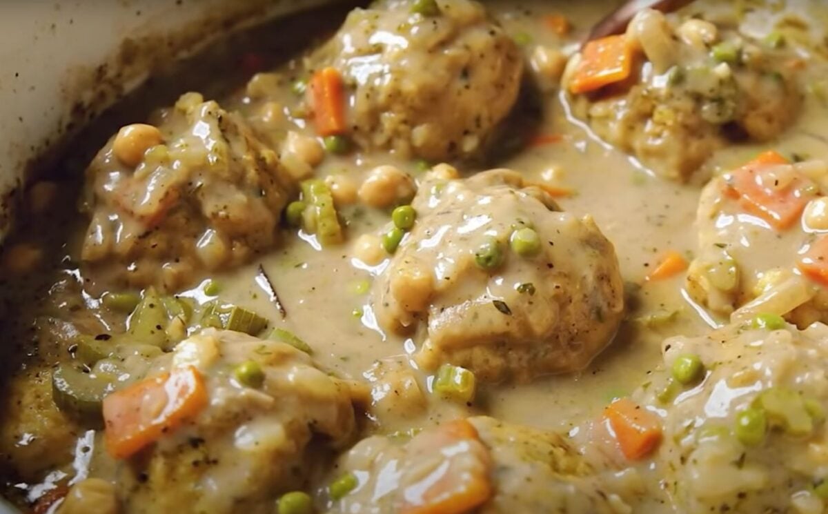 A saucepan containing a vegan chicken dumplings recipe, the ultimate plant-based comfort food