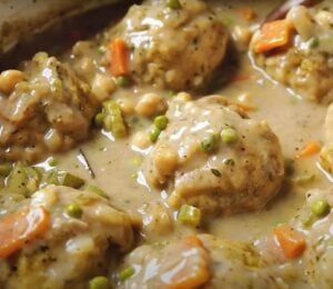 A saucepan containing a vegan chicken dumplings recipe, the ultimate plant-based comfort food
