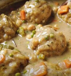 A saucepan containing a vegan chicken dumplings recipe, the ultimate plant-based comfort food