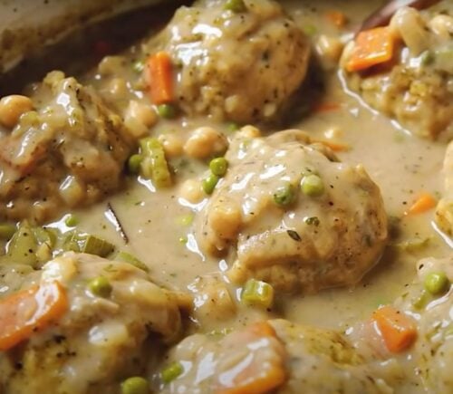 A saucepan containing a vegan chicken dumplings recipe, the ultimate plant-based comfort food