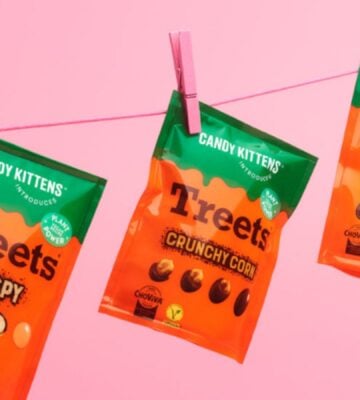 Photo shows all three varieties of the new Candy Kittens x Treets vegan chocolates pegged to a line against a pink background