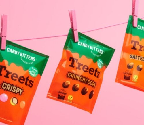 Photo shows all three varieties of the new Candy Kittens x Treets vegan chocolates pegged to a line against a pink background