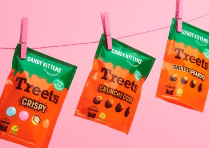 Photo shows all three varieties of the new Candy Kittens x Treets vegan chocolates pegged to a line against a pink background