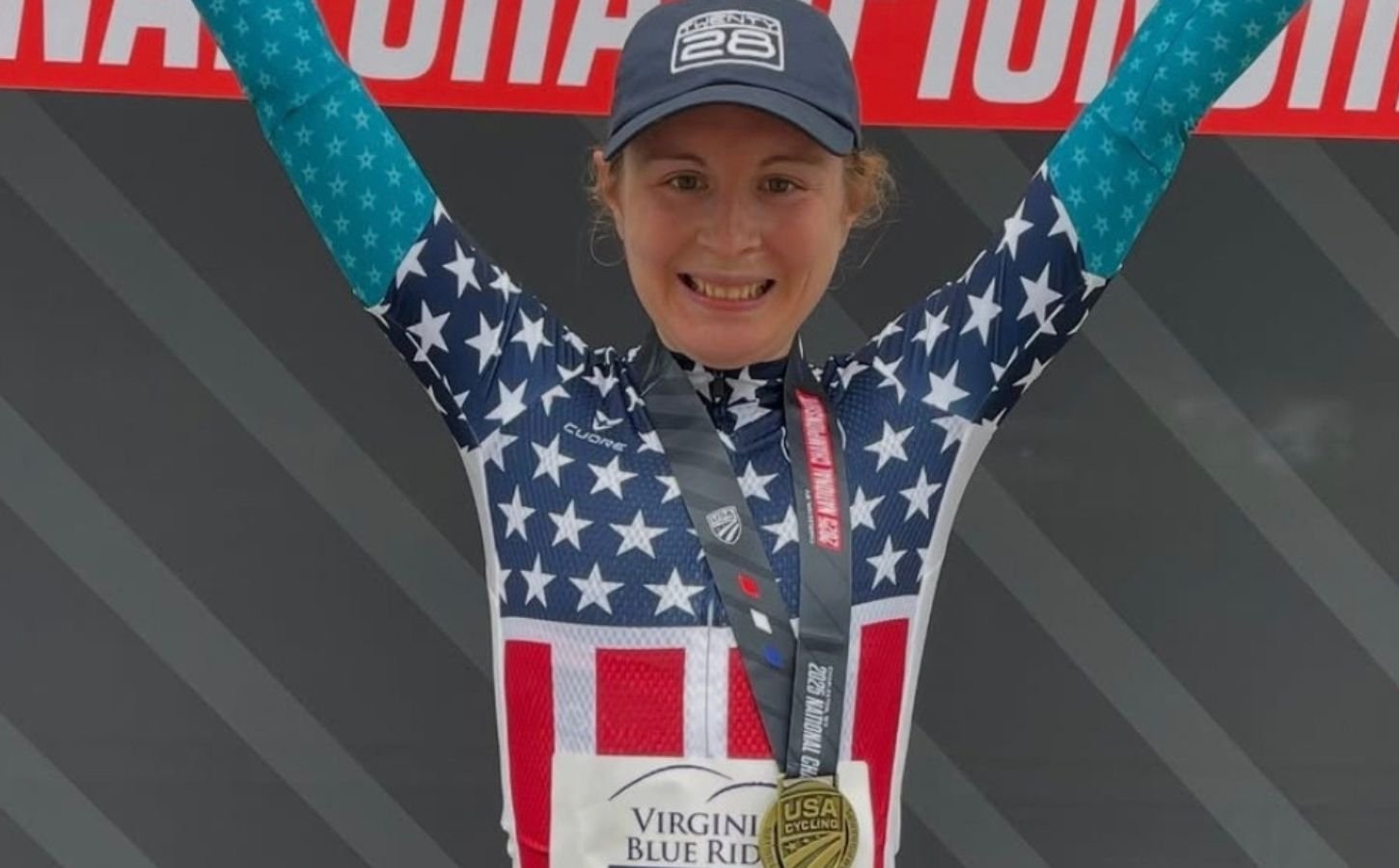 Photo shows vegan cyclist Emily Ehrlich celebrating her recent time trial win