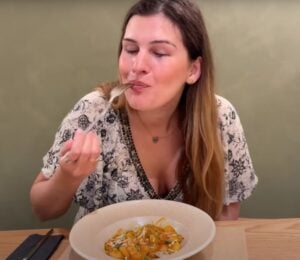 Nicole Whittle eating gnocchi at a fully vegan hotel in Rhodes, Greece