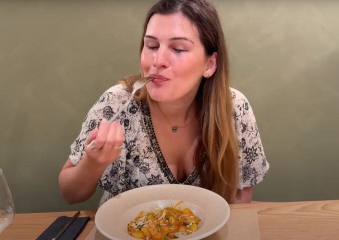 Nicole Whittle eating gnocchi at a fully vegan hotel in Rhodes, Greece