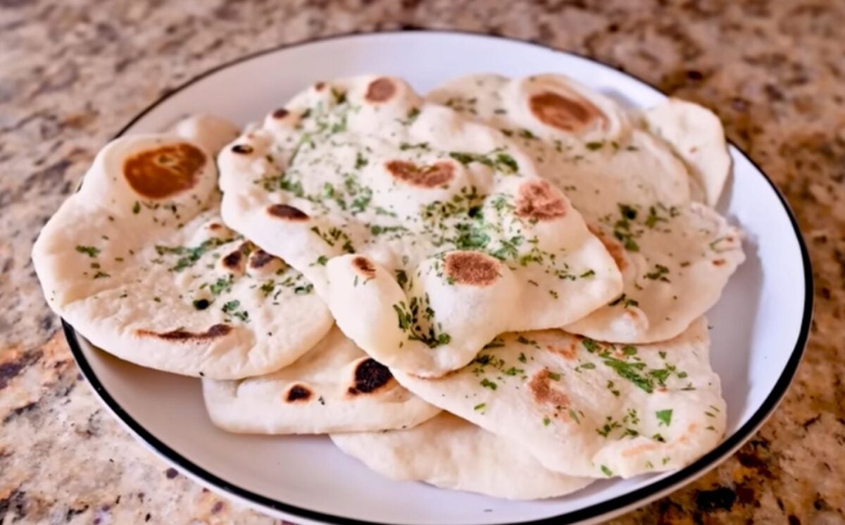A plate full of homemade vegan naan recipe with dairy-free garlic butter