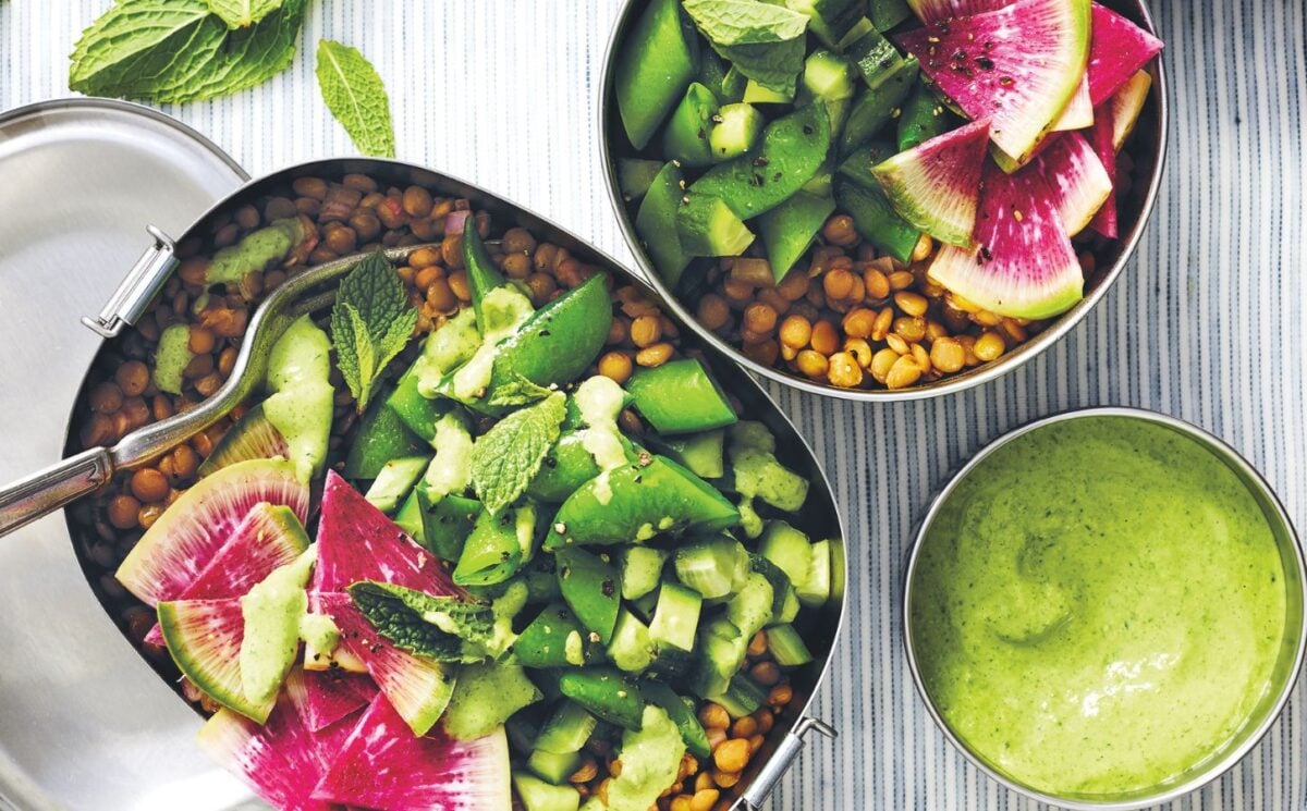 a picture of a vibrant lentil salad with snap peas, watermelon radish, cucumber, and lemon for vegan lentil recipes to make in summer