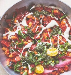 a pan of baked shakshuka with butter beans and aubergine