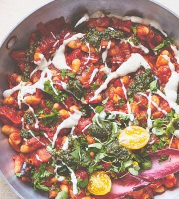 a pan of baked shakshuka with butter beans and aubergine