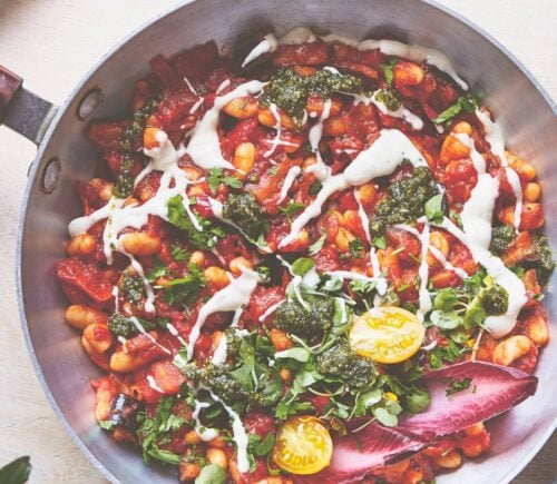 a pan of baked shakshuka with butter beans and aubergine