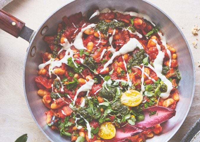 a pan of baked shakshuka with butter beans and aubergine
